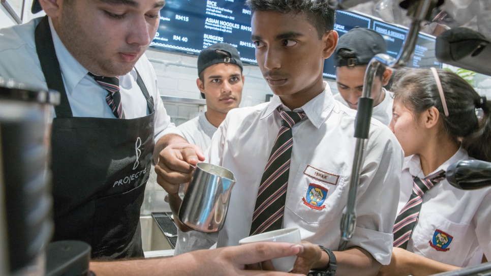 After school, Ishak receives vocational training as a barista. 