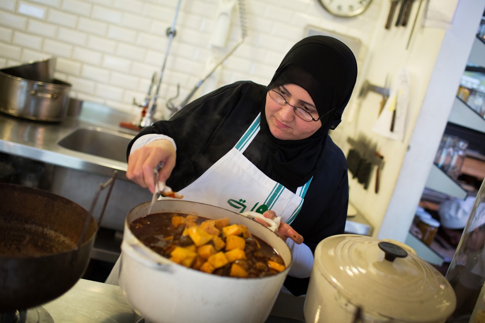 Ibtisim Masto, from Idlib, adds the finishing touches to kibbeh balls with meat chunks and diced quince in a tomato gravy.