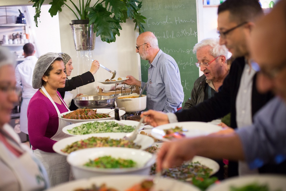 Refugee chefs Nahrein Abdal and Mariam Al Bakkour serve lunch to diners at Tawlet, a restaurant in Beirut.