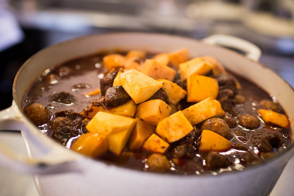 Kibbeh balls with meat chunks and diced quince in a tomato gravy, prepared by Syrian refugee women at Tawlet restaurant in Beirut, Lebanon.