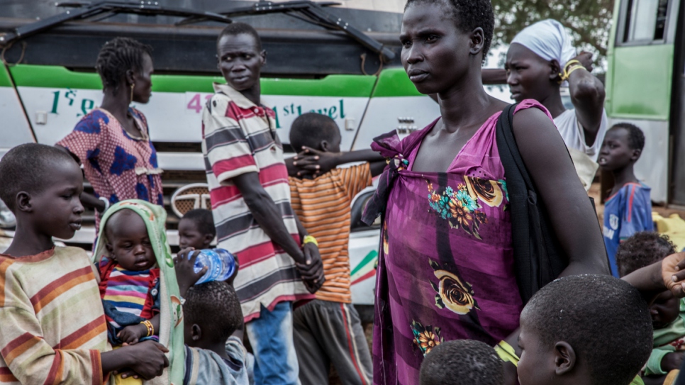 South Sudanese refugee Nyawett, accompanied by 10 children, shortly after reaching Gure Shombola camp, in Ethiopia.