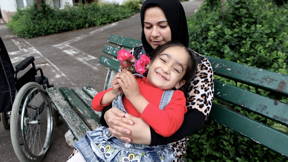 Syrian refugee Aya, 4, has spina bifida, meaning she is paralyzed from the waist down. She has been resettled in Laval, north-west France with her family.