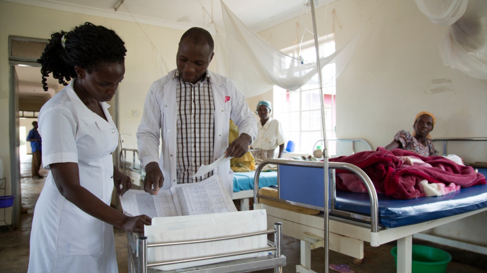 Bosco and his colleague review the patients' files.