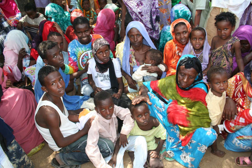 A Somali family from Mogadishu wait outside the Djibouti Refugee Agency office, seeking to register as asylum seekers.