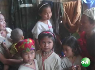 A group of Karen children, who say they were used as porters by soldiers in Burma, gather in a village for refugees in northern Thailand, Aug. 23, 2009.