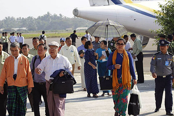 Members of the Maungdaw Investigation Commission arrive at the airport in Sittwe, western Myanmar's Rakhine state, Feb. 1, 2017.