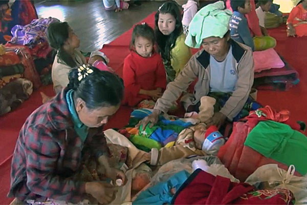 Myanmar villagers who fled fighting between government troops and Ta'ang National Liberation Army soldiers take shelter in a school in Kyaukme, Myanmar's northern Shan state, Dec. 29, 2016.