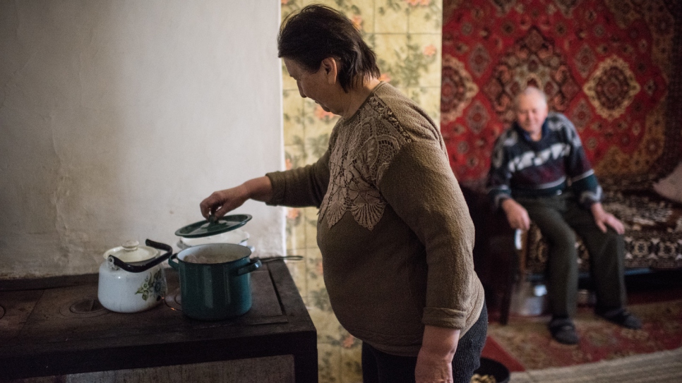 Nina, 62, and Victor, 67, at home in the village of Luhanske, Donetsk.