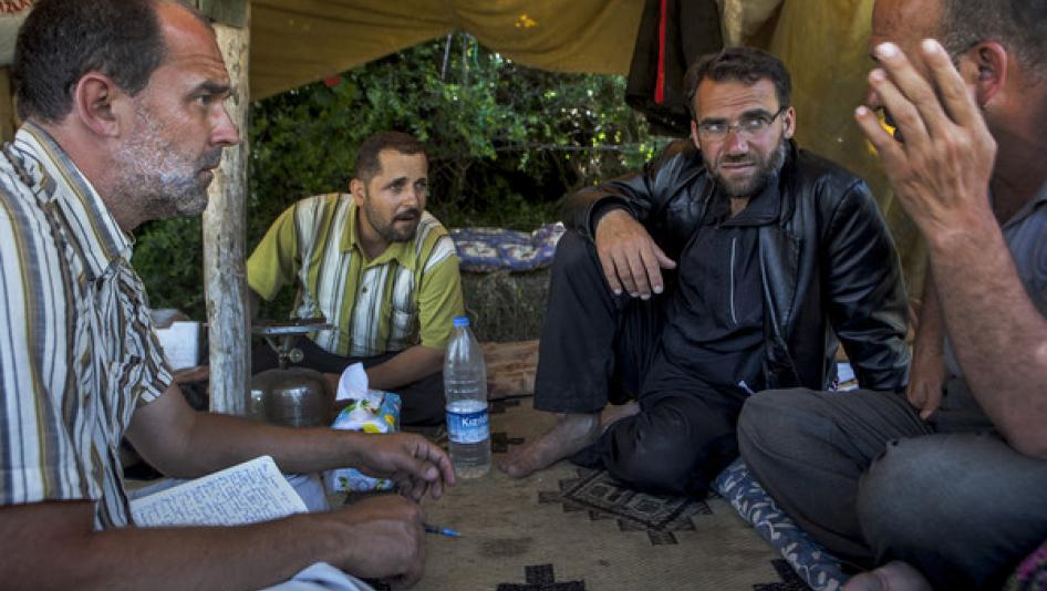 Peter Bouckaert, emergencies director, interviews refugees from the conflict in Syria at the Turkish border in July 2011.