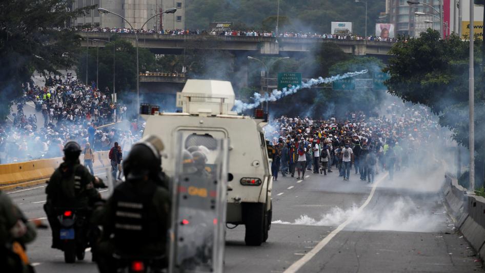 Police fire tear gas toward opposition supporters during clashes while rallying against Venezuela's President Nicolas Maduro in Caracas, Venezuela, April 20, 2017.