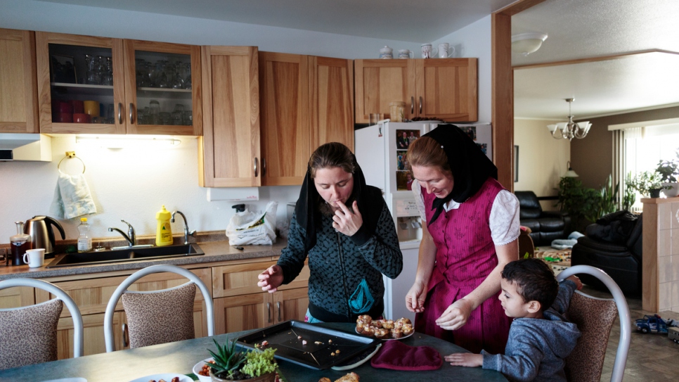 Alice Hofer (left) and her sister Elaine prepare food for the Al Hamoud children.