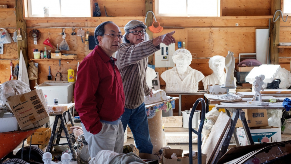 Brothers Trung and John Pham in Trung's studio. 