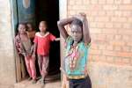 Intenally displaced children at the entrance of an empty warehouse in ...