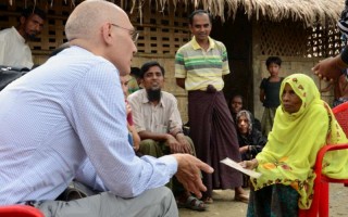 Assistant High Commissioner for Protection Volker Türk speaks with an elderly woman in a Rohingya village near Maungdaw, northern Rakhine State, Myanmar, on 12 July 2015.