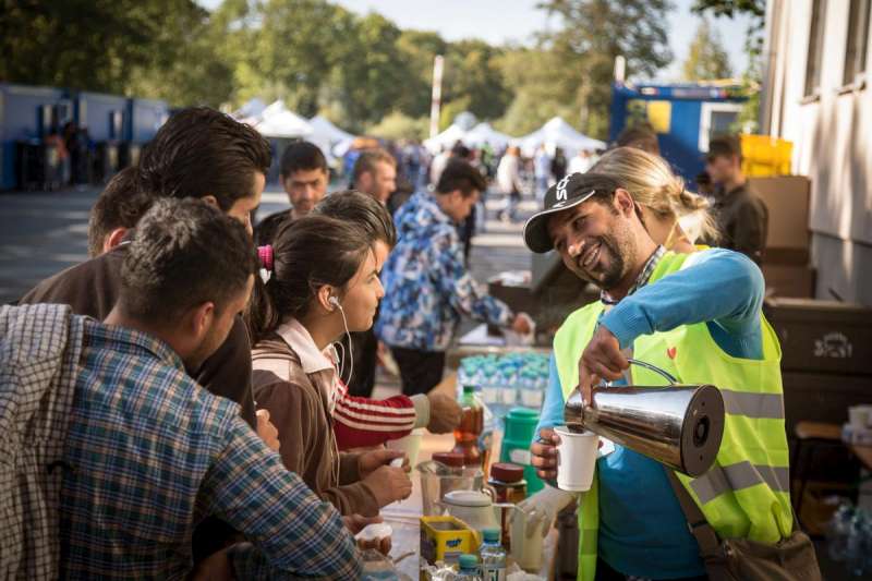 Refugees themselves, Iraqis volunteer to help others reach safety in Germany