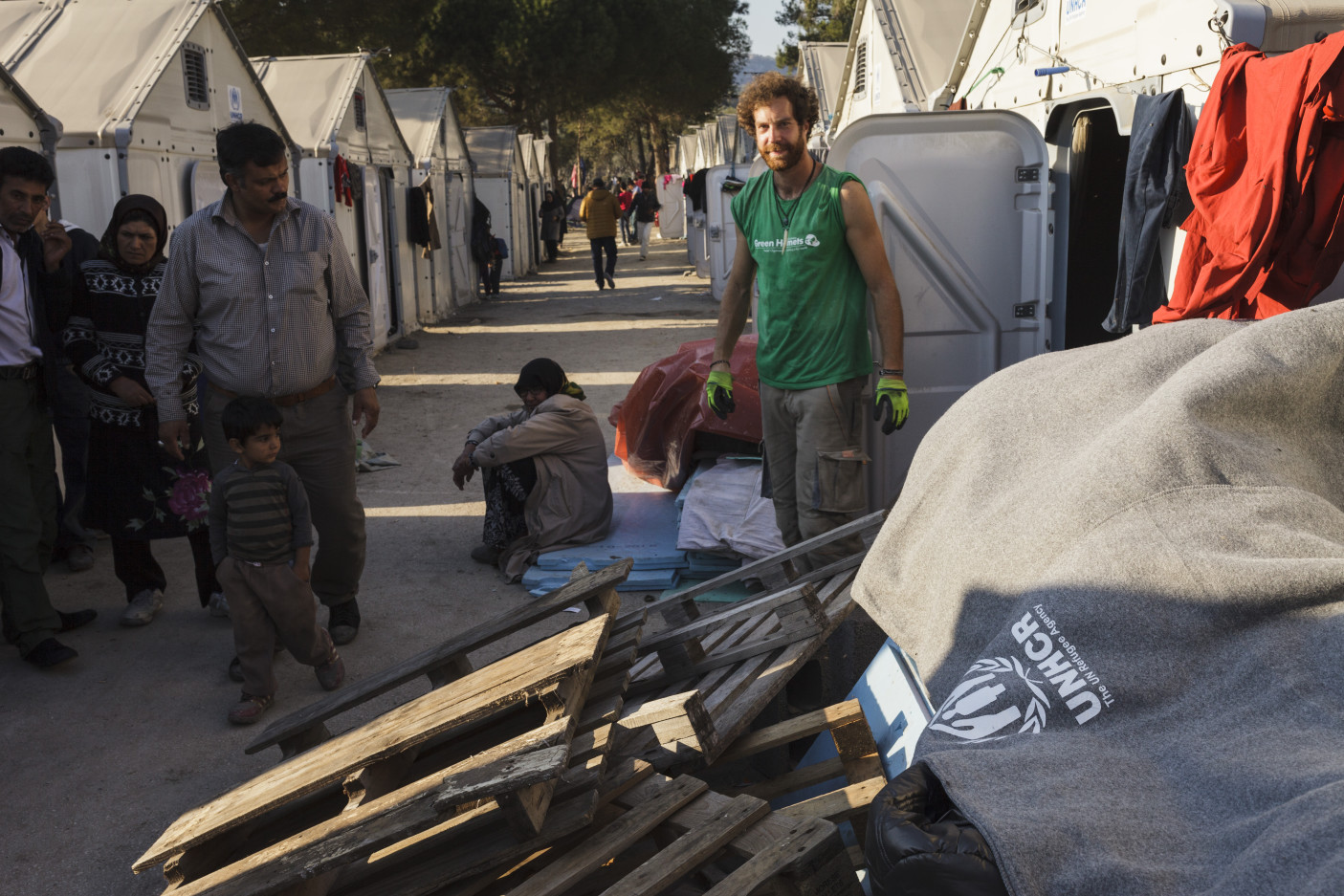 Greece. Volunteers build wooden floors to winterise refugee housing units in the Moria Reception/Registration Centre.