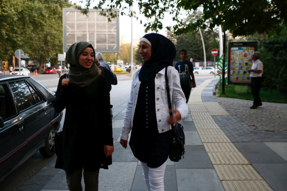 Fatima (right) and her friend Rawan, both 19 from Syria, are photographed on the streets of Ankara after meeting the UN High Commissioner for Refugees, Filippo Grandi. © UNHCR/Ali Unal