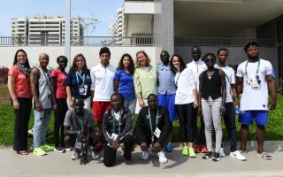 The Refugee Olympic Team poses with UN Deputy High Commissioner for Refugees Kelly Clements and staff in Rio’s Olympic Village.  © UNHCR