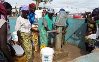 Refugees from Nigeria queue to get water at the Minawao camp in Cameroon. UNHCR has registered over 40,000 Nigerian refugees in Cameroon's Far North region to date, and 32,000 of them have moved to Minawao.