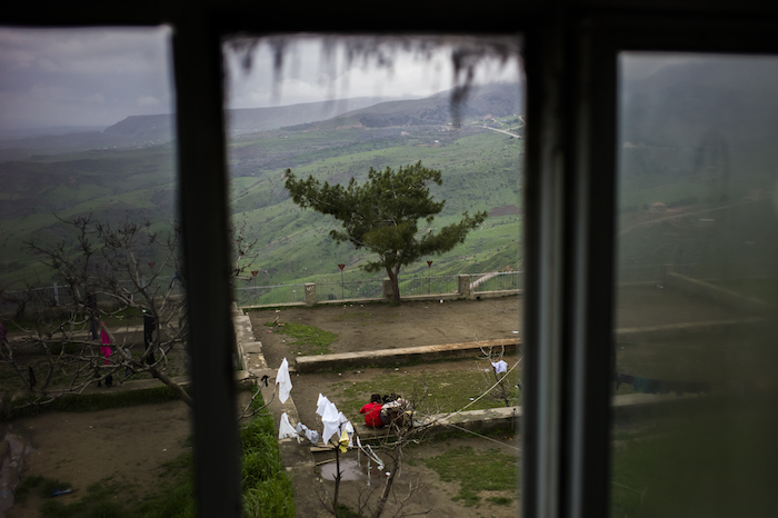 A tree and a fence mark the edge of the garden in Amadi. Asam, 17, went down the hill to retrieve a football and stepped on a mine.  © UNHCR/Dominic Nahr  