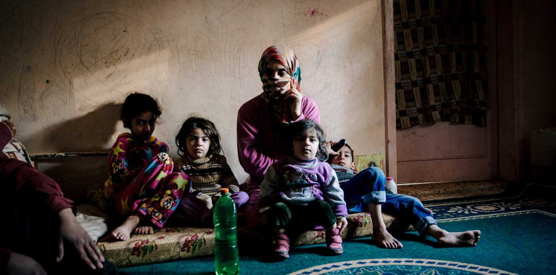 Reema with her children in their apartment in Ramtha, Jordan 