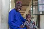 Mr Mustapha and his son who is enrolled in a nursery class at the school. Future Prowess Islamic Foundation School (I), Maiduguri, Borno State, Nigeria.