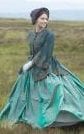Jenna Coleman as Victoria, wearing a jacket, full skirt and bonnet in 1840s style