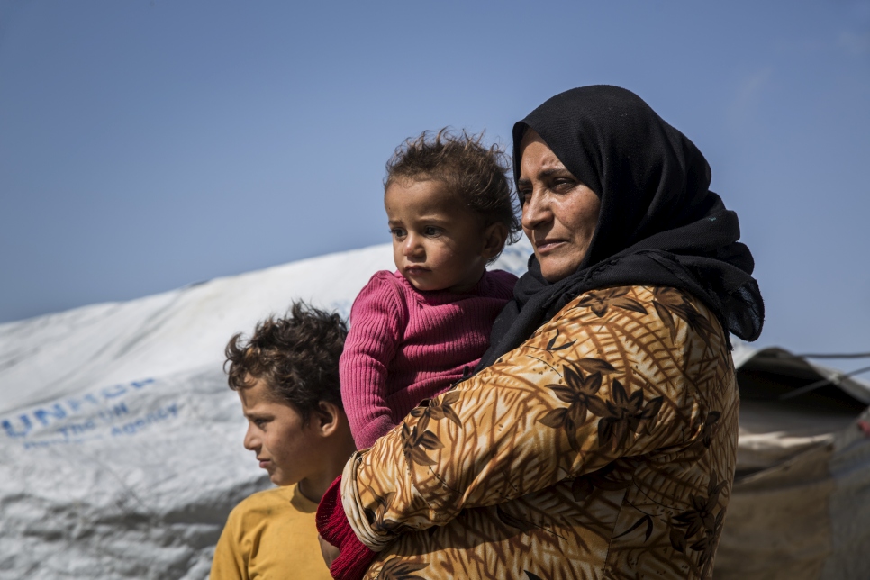 Nuzha from Aleppo, 39, with two of her children, Mustafa, 1, and Hassan, 10, in¬the Pioneer Camp for internally displaced persons in Tartous, Syria.