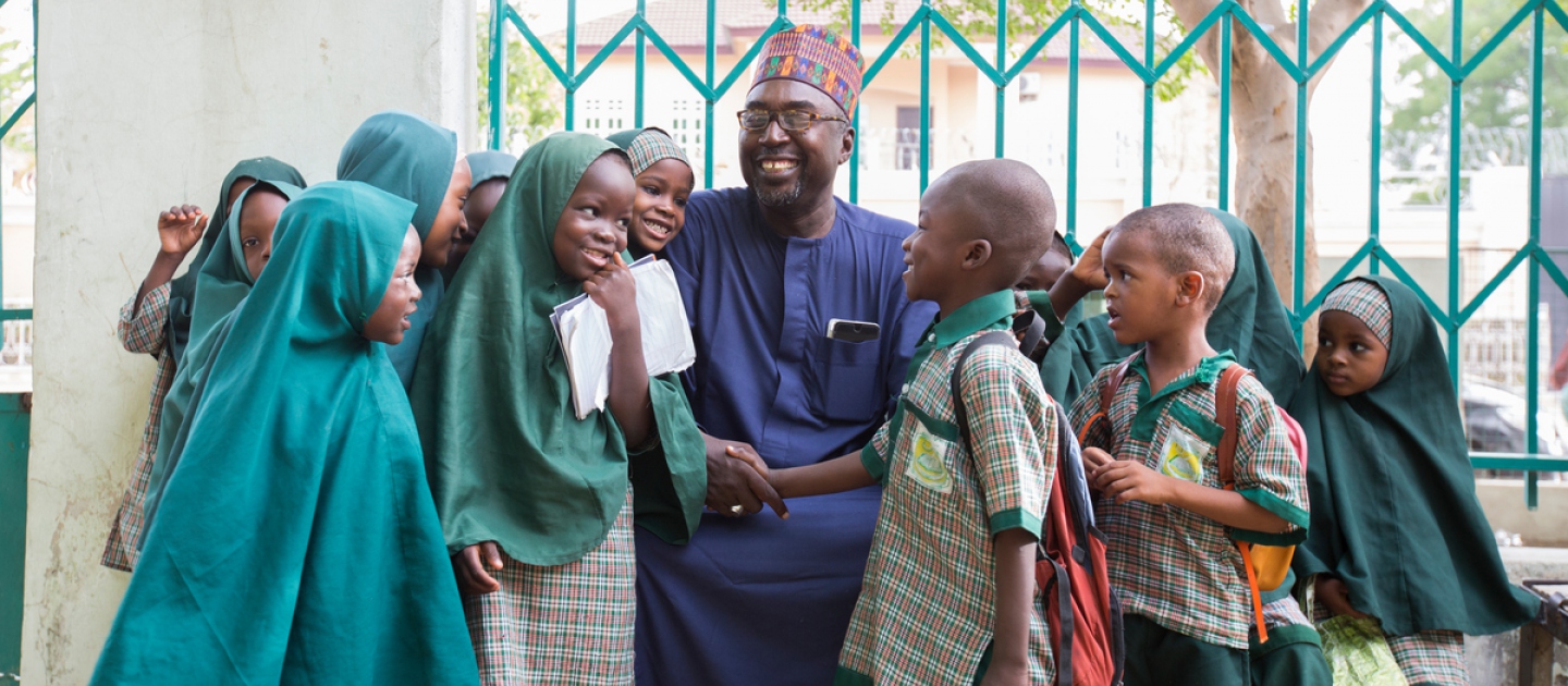 Mustapha and the students of Future Prowess Islamic Foundation School before morning assembly.