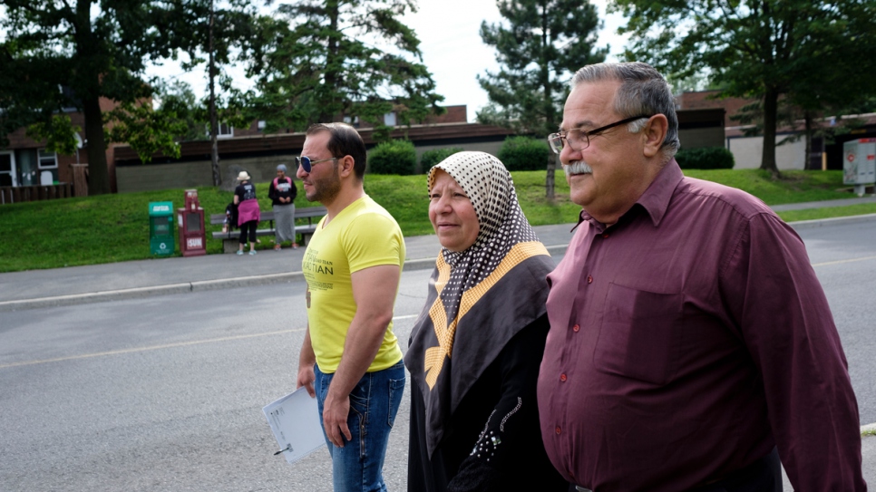 Mohammed walks to English class with his mother Jameeleh and father Mansoor.