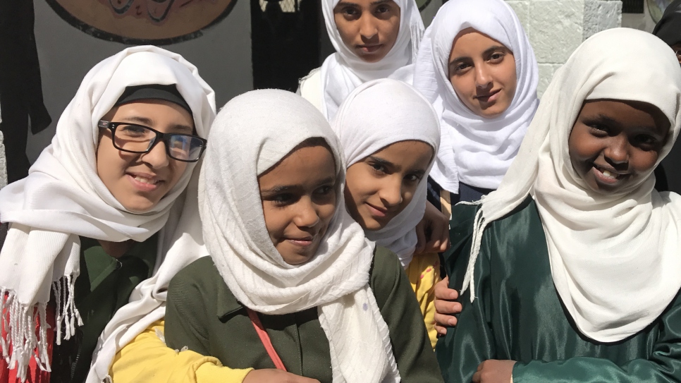 Despite conflict and adversity, Afrah, far right, is determined to stay in school in Yemen. Like millions of others caught up in Yemen's brutal conflict, 12-year-old Somali refugee Afrah's immediate concern is surviving the bombs, bullets and gnawing poverty it has created.