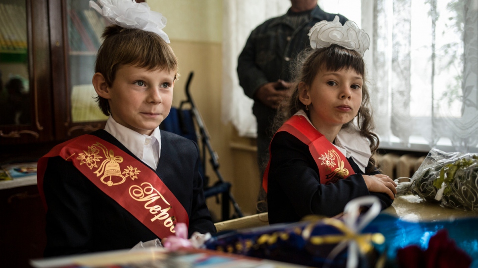 On her first day at school, Lera proudly wore a big white bow on her head.