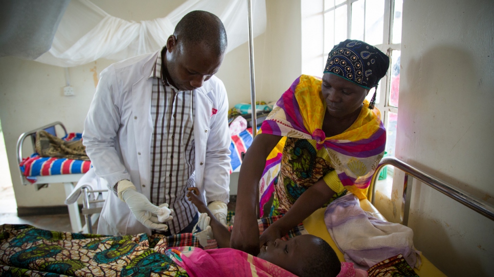 Bosco gives pain relief to nine-year-old Zakaio.