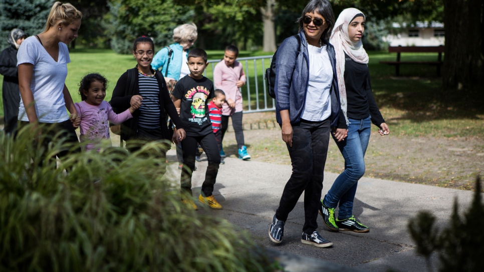 Thuy Nguyen and Narjes Nouman enjoy a sunny day at a park on the Toronto Islands.