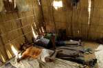 Newly-arrived teenage refugees from Eritrea rest in the male reception centre of the Wad Sherife refugee camp in eastern Sudan. 