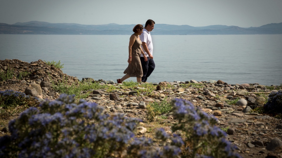 Efi Latsoudi and HRT leader Konstantinos Mitragas, joint winners of the 2016 Nansen Award, walk along a beach in northern Lesvos.