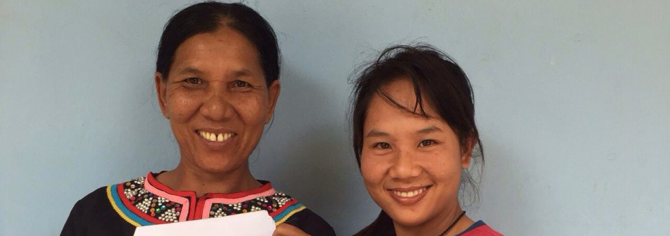 Single mother Manee, left, holds up a copy of her newly acquired Thai National ID Card, accompanied by her daughter, right, in Chiang Rai, Thailand.   © UNHCR Thailand