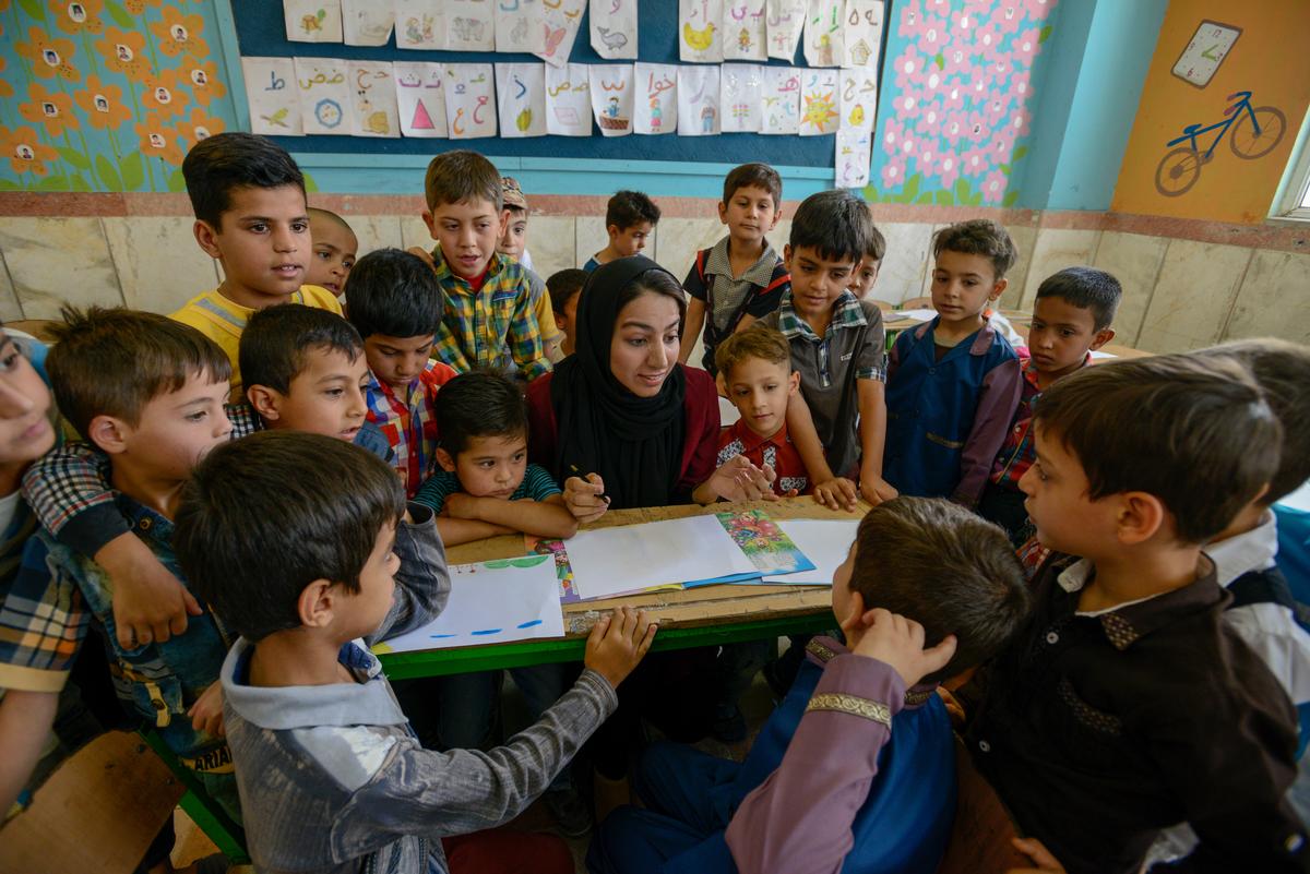 Sonita teaches young Afghan refugees at a summer school in Iran.