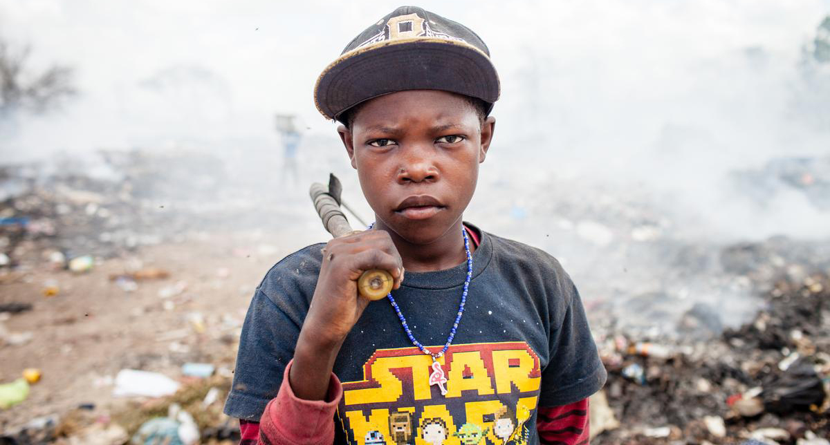 Joe Hullman, 13, works at San Pedro de Macoris municipal dump during his summer vacations looking for metal scraps in San Pedro de Macoris, in Dominican Republic.