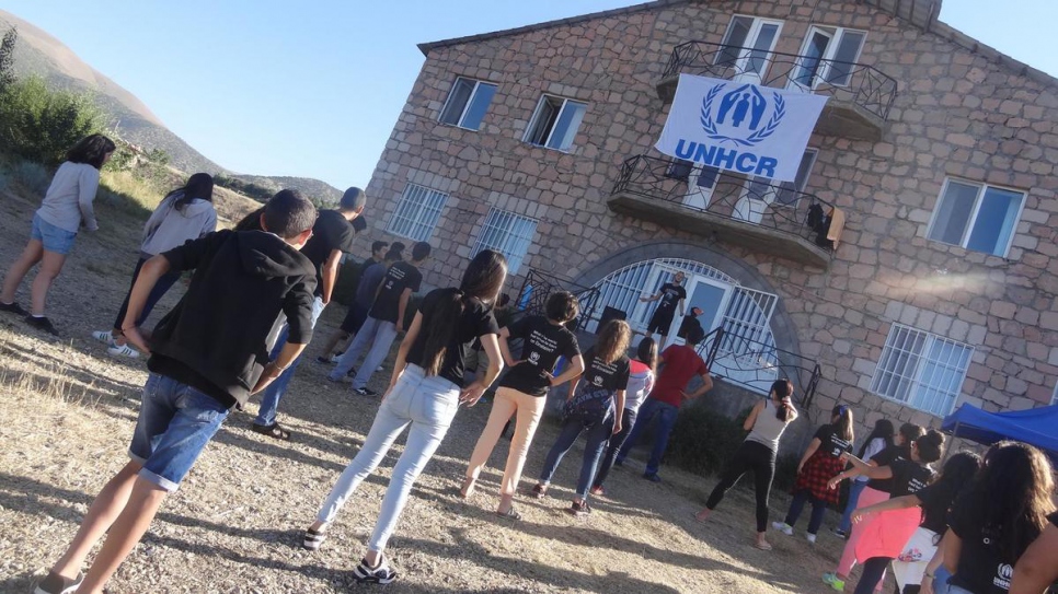 Displaced and refugee youth take part in morning exercises.