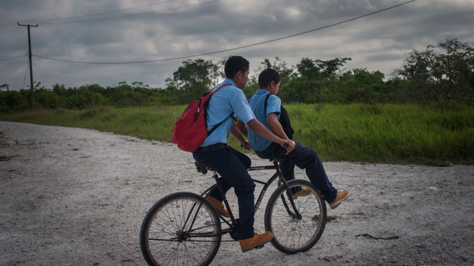 Ulises Menendez, 15, and his 11-year-old brother Juan Roberto on their way to school in the Valley of Peace. 

