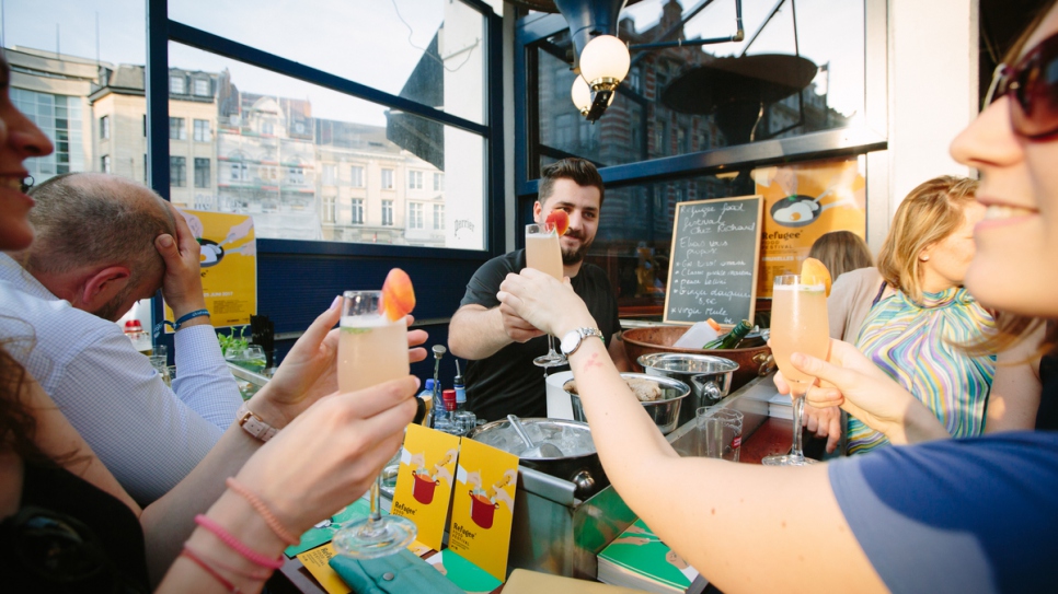 Elias and customers raising their glasses at Chez Richard in Brussels. 

All the pictures were taken by Bea Uhart