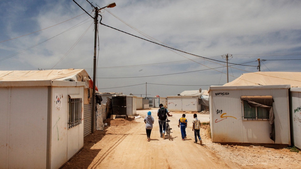 Fadi takes children to school at Za'atari refugee camp in Jordan.