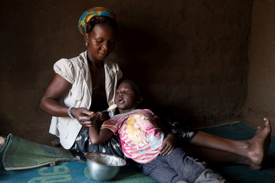 South Sudanese refugee Aisha, 29, looks after five children in Bidibidi refugee settlement. A single mother, she cares for her own two sons and a nephew and niece, and also fosters four-year-old Mercy, who is is semi-paralysed and needs constant care.  