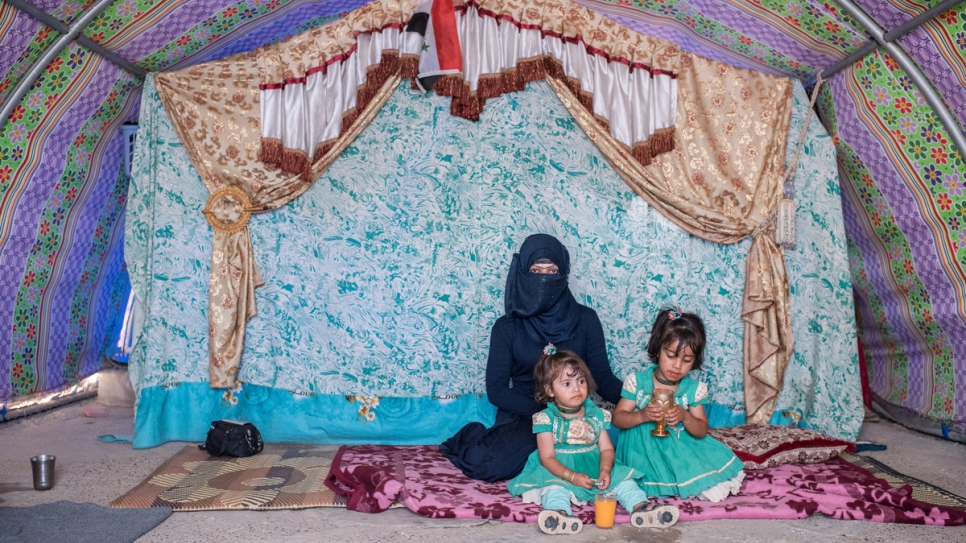 Asmaa Mahmood, 27, and her two children Rimah, 4, and Bedoor, 2.