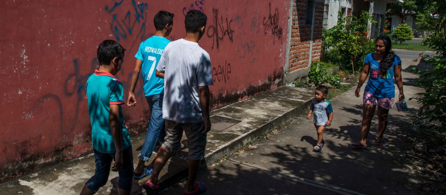 Young refugees from El Salvador head off to play street football in their adopted city of Tapachula, southwest Mexico, close to the border with Guatemala, in this September 2016 file photo.
