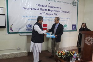 Representative of UNHCR in Pakistan Indrika Ratwatte handing over the health project to Secretary Health  Asmatullah Kakar. (C) UNHCR/H.Karim