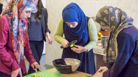 Volunteers give refugees a taste of life in Lithuania