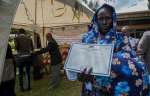 South Sudanese refugee Ariat Ochocka Odulla with her 18 day-old son An...