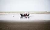 At least four Rohingya refugees died when their boat capsized close to...